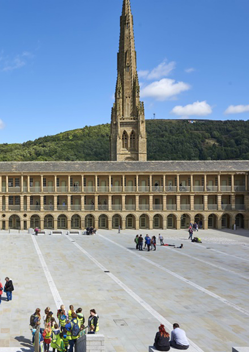 The piece hall courtyard, with the church spire in the background.