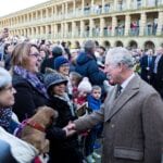 Prince Charles Greets people in the courtyard of the piece hall.