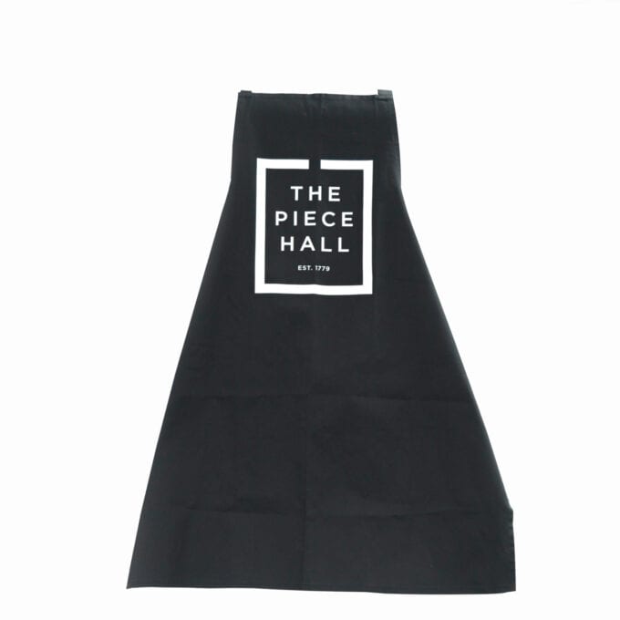 The piece hall apron in black.