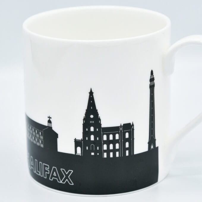 The piece hall bone china cup, with silhouetted piece hall design.