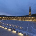 The piece hall courtyard, lit by many lights.